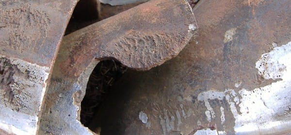 heavy damage by cavitation and corrosion on turbine blade