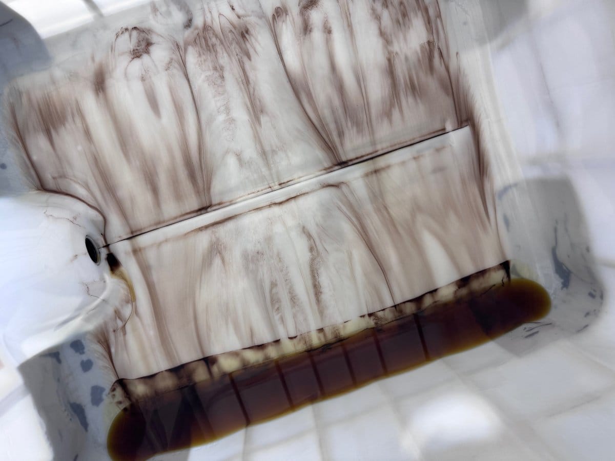 IBC with brand new oil contaminated with particulate matter